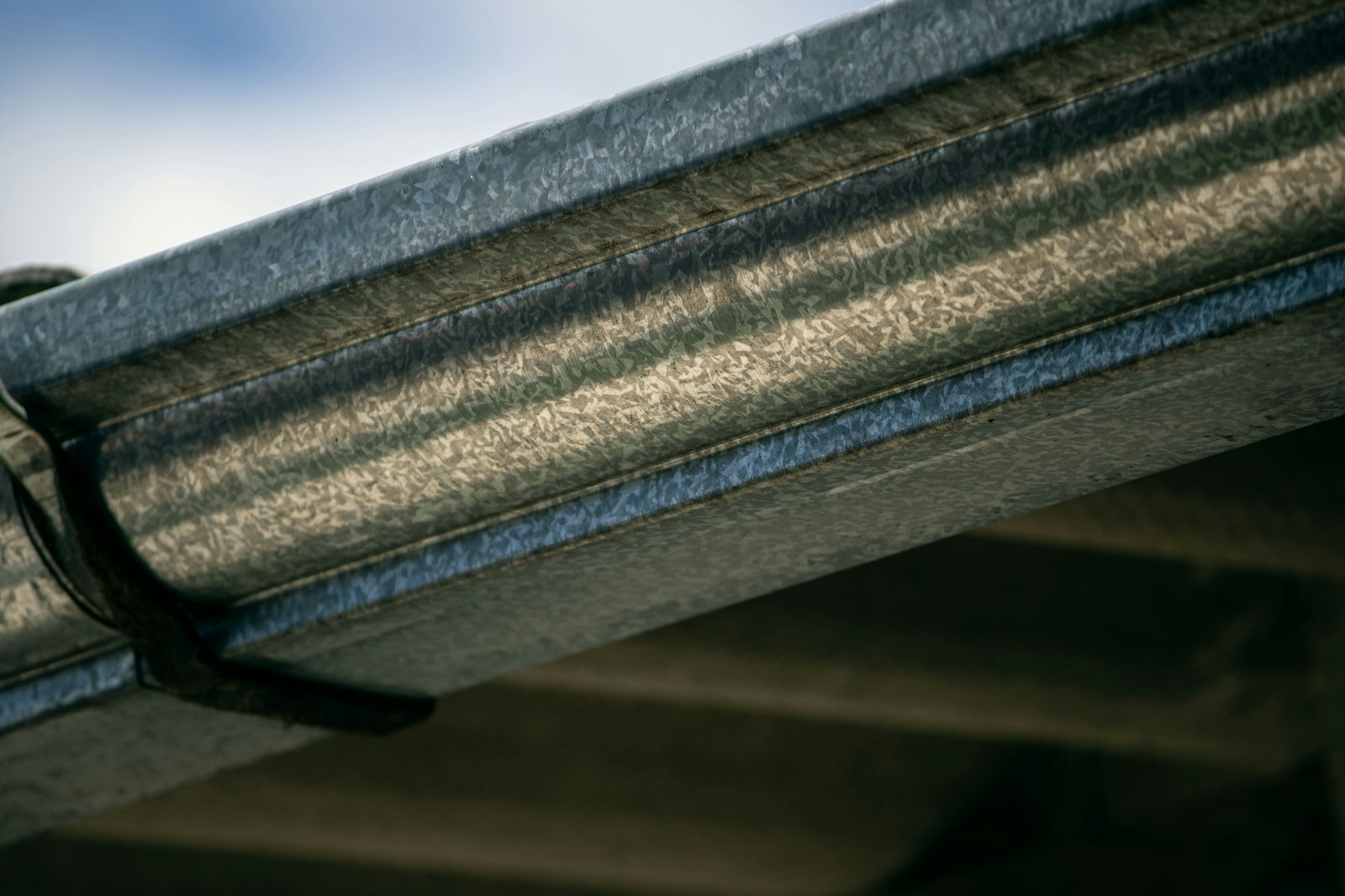 Close-up of a newly installed metal gutter
