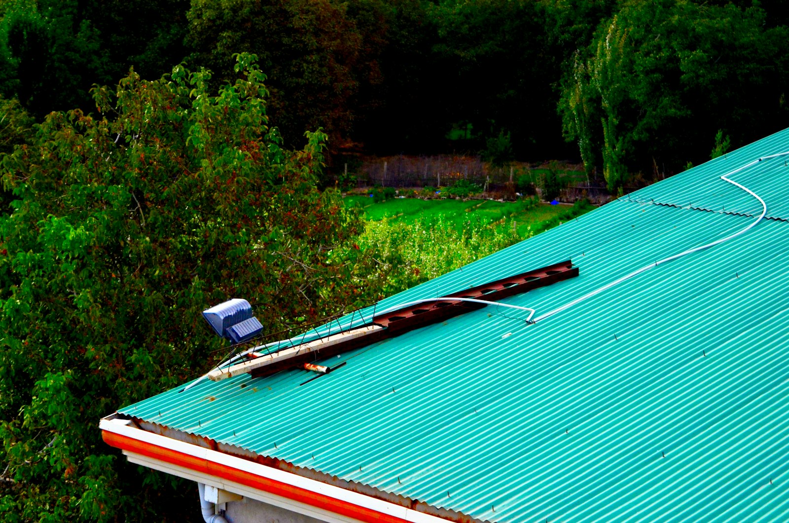 Damaged metal roof panel needing repair